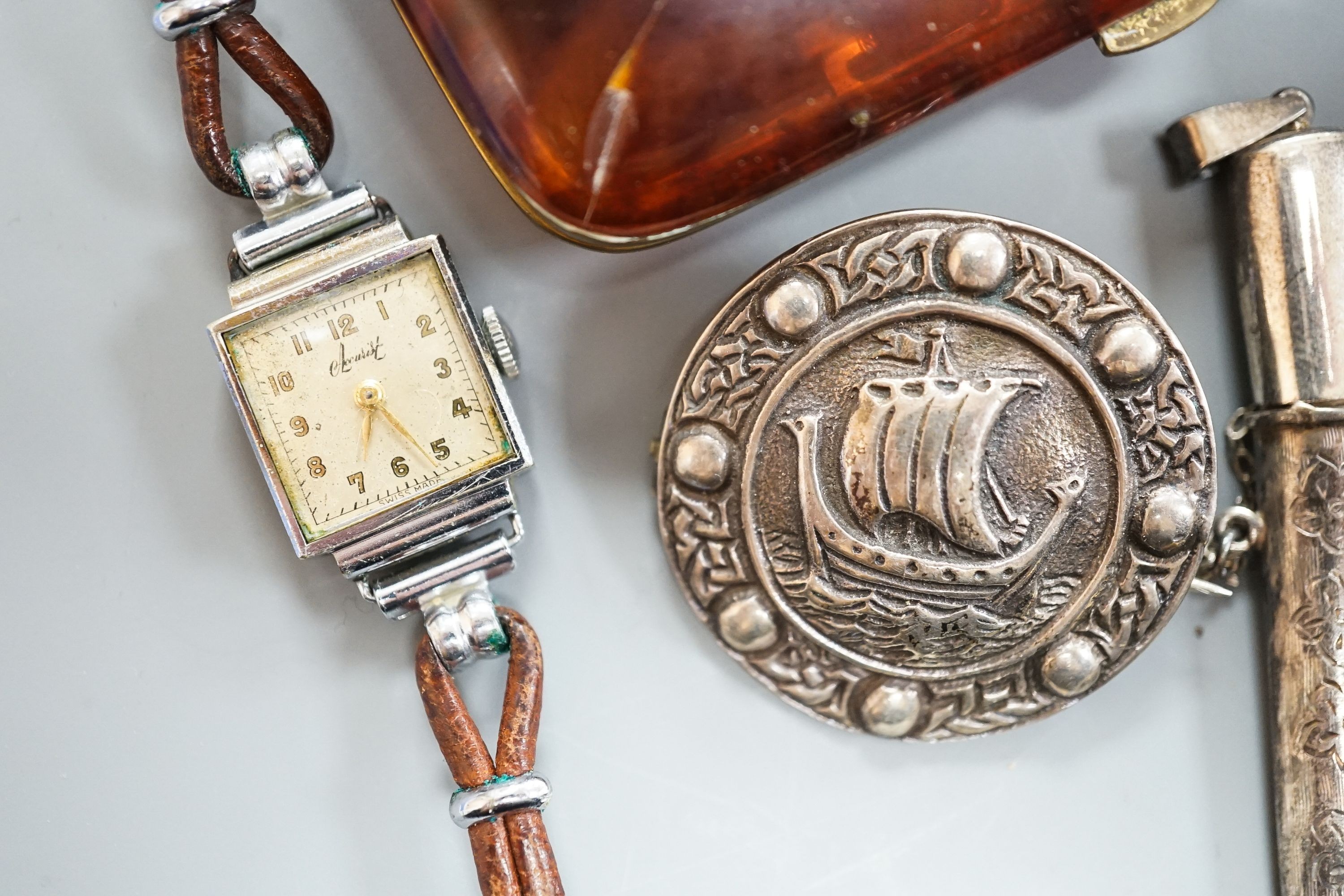 An engraved silver bangle, two silver brooches, including Scottish, two lady's wrist watches and a small group of minor jewellery, etc.